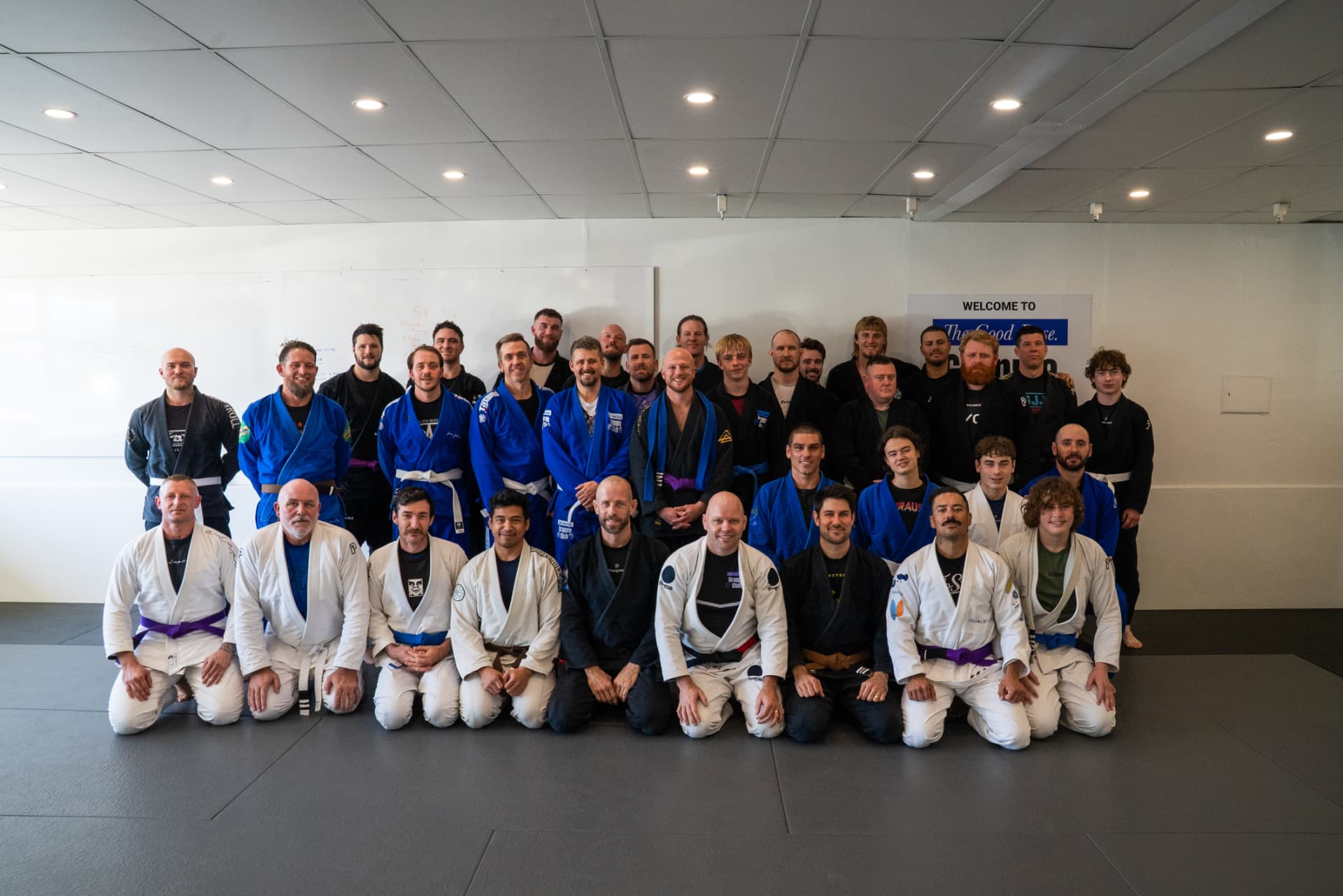 The Good Dose adult team after training on the mats in Wynnum