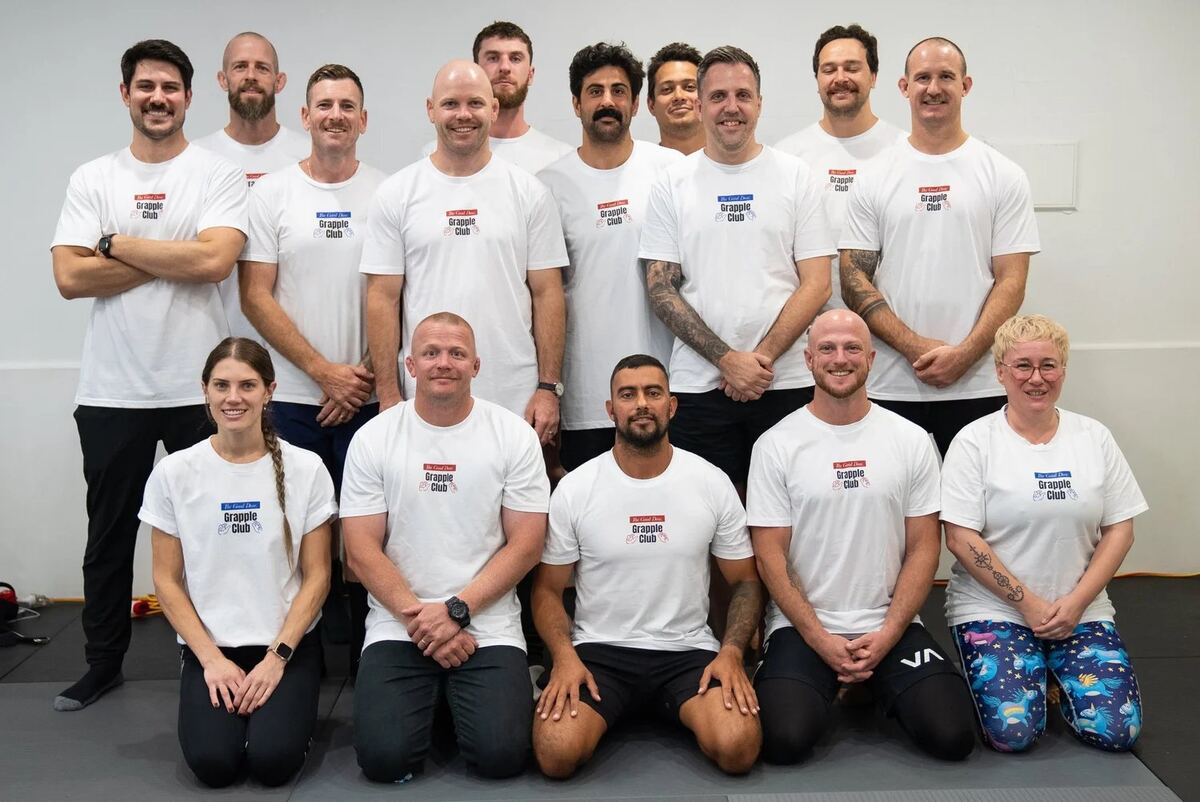 The Good Dose coaching team on the mats